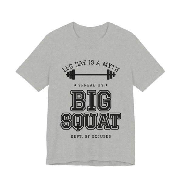 Athletic Heather t-shirt printed in dark ink with “Leg Day Is a Myth” arched over a barbell, then “Spread by” and “Big Squat” in varsity letters, signed “Dept. of Excuses”