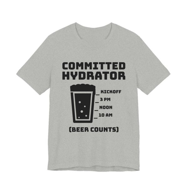 Athletic Heather t-shirt printed in dark ink with “Committed Hydrator” above a pint glass with fill lines marked 10 AM, Noon, 3 PM and Kickoff, and “(Beer Counts)”