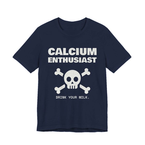 Navy t-shirt printed in off-white ink with “Calcium Enthusiast” above a skull and crossbones, with “Drink your milk.”
