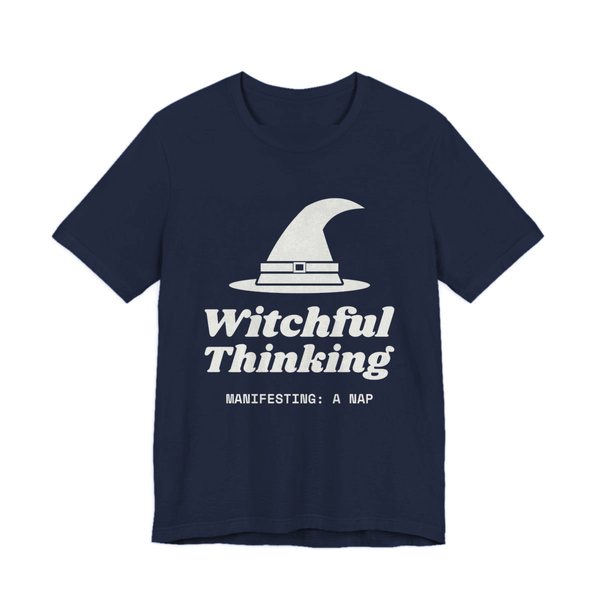 Navy t-shirt printed in off-white ink with a witch hat above “Witchful Thinking” in script, with “Manifesting: a nap”