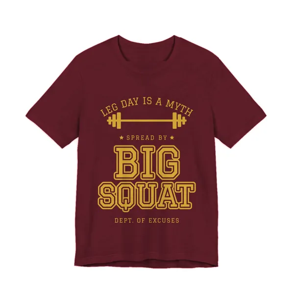 Leg Day Is a Myth Spread by Big Squat tee printed in gold ink on a maroon shirt