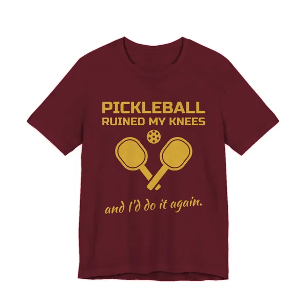 Pickleball Ruined My Knees and I'd Do It Again tee printed in gold ink on a maroon shirt