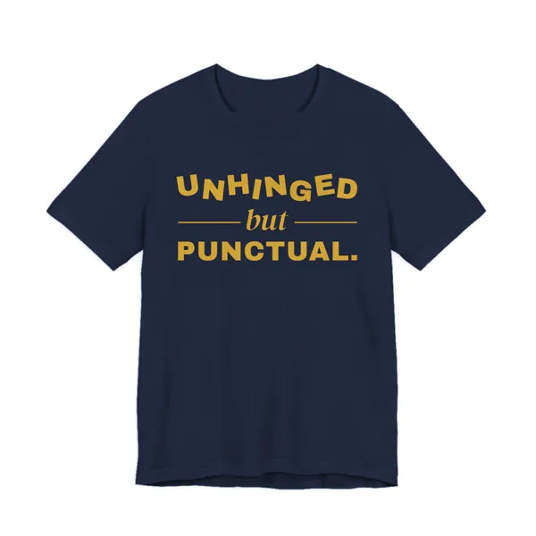 Unhinged but Punctual tee printed in gold ink on a navy shirt