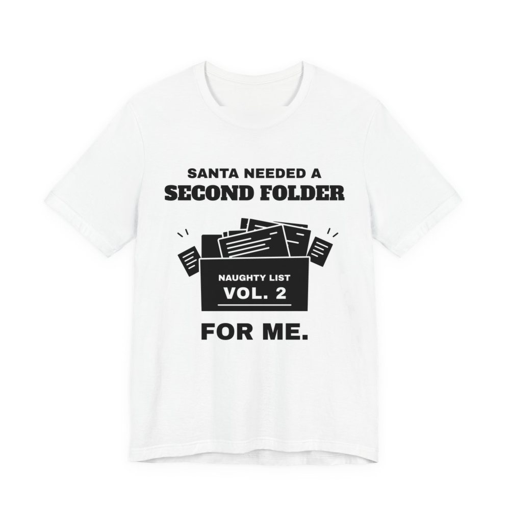 White t-shirt printed in dark ink with “Santa Needed a Second Folder for Me” with an overstuffed file box labeled “Naughty List Vol. 2”