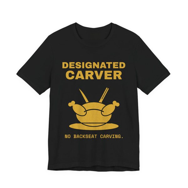 Black t-shirt printed in gold ink with a crossed carving knife and fork and the words “Designated Carver”
