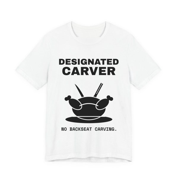 White t-shirt printed in dark ink with a crossed carving knife and fork and the words “Designated Carver”