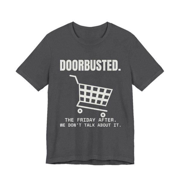 Dark Grey Heather t-shirt printed in off-white ink with the word “Doorbusted.”