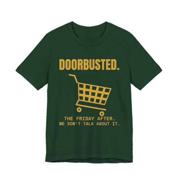 Forest t-shirt printed in gold ink with the word “Doorbusted.”