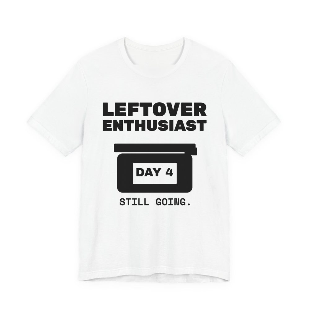 White t-shirt printed in dark ink with a takeout-style leftovers container and the words “Leftover Enthusiast”