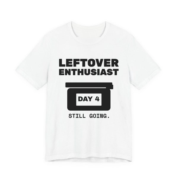 White t-shirt printed in dark ink with a takeout-style leftovers container and the words “Leftover Enthusiast”