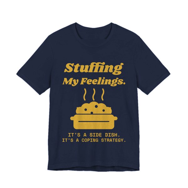Navy t-shirt printed in gold ink with the words “Stuffing My Feelings.”