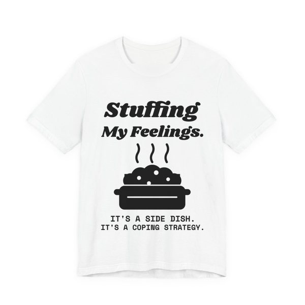White t-shirt printed in dark ink with the words “Stuffing My Feelings.”