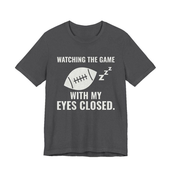 Dark Grey Heather t-shirt printed in off-white ink with the words “Watching the Game With My Eyes Closed.”