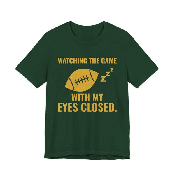 Forest t-shirt printed in gold ink with the words “Watching the Game With My Eyes Closed.”